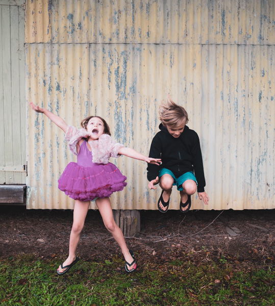 photo-of-boy-jumping-beside-girl-2624875.jpg